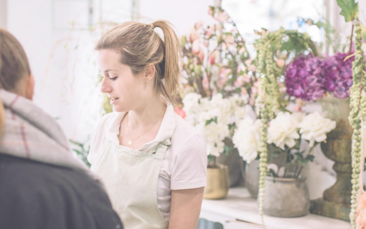 Detailed view of custom floral arrangement process